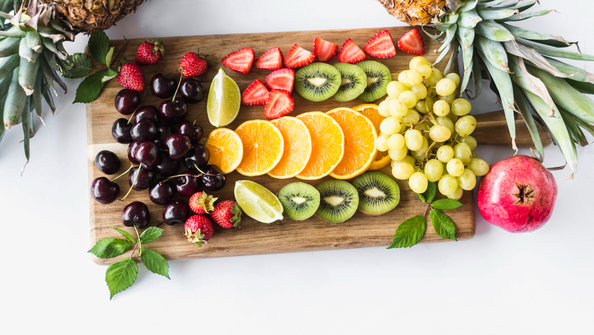 A weekly meal planning notebook surrounded by simple fresh ingredients